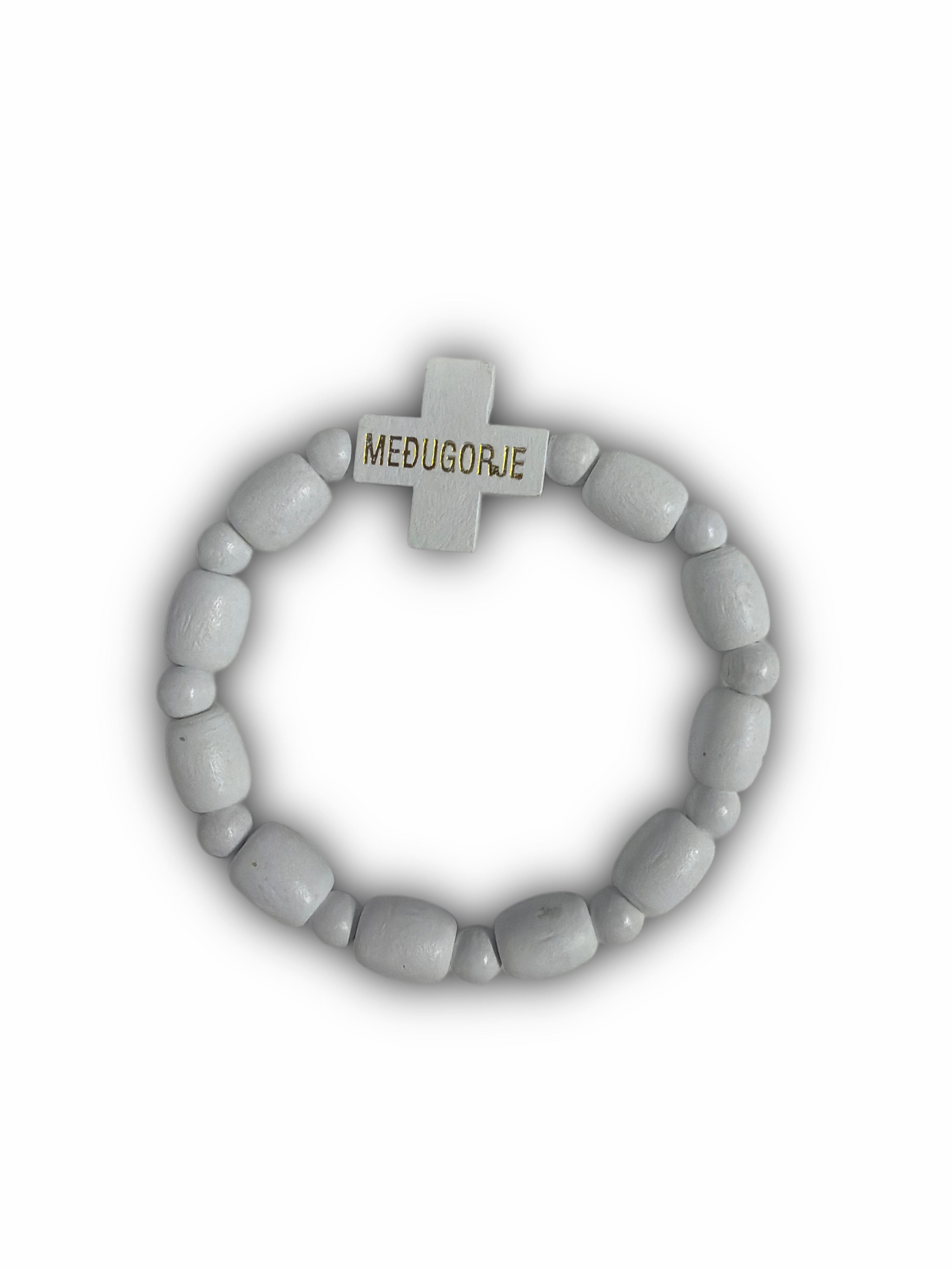 Beaded bracelet with a cross charm on a white background